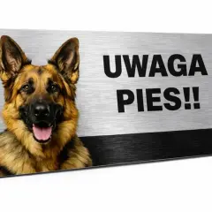 Tabliczka z napisem "UWAGA PIES!!" i wizerunkiem owczarka niemieckiego. Czy taka tabliczka uwaga pies jest obowiązkowa?